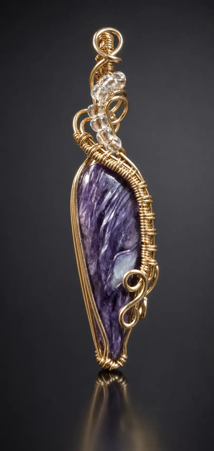 Handmade gold wire-wrapped purple charoite pendant with clear quartz beads — artisan commissioned jewelry