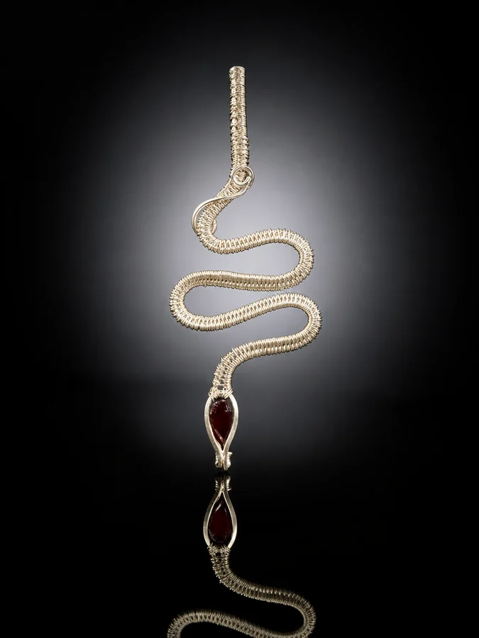 Handcrafted Sterling Silver Snake Pendant with Faceted Garnet